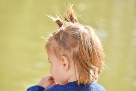 Why do children get more lice than adults?